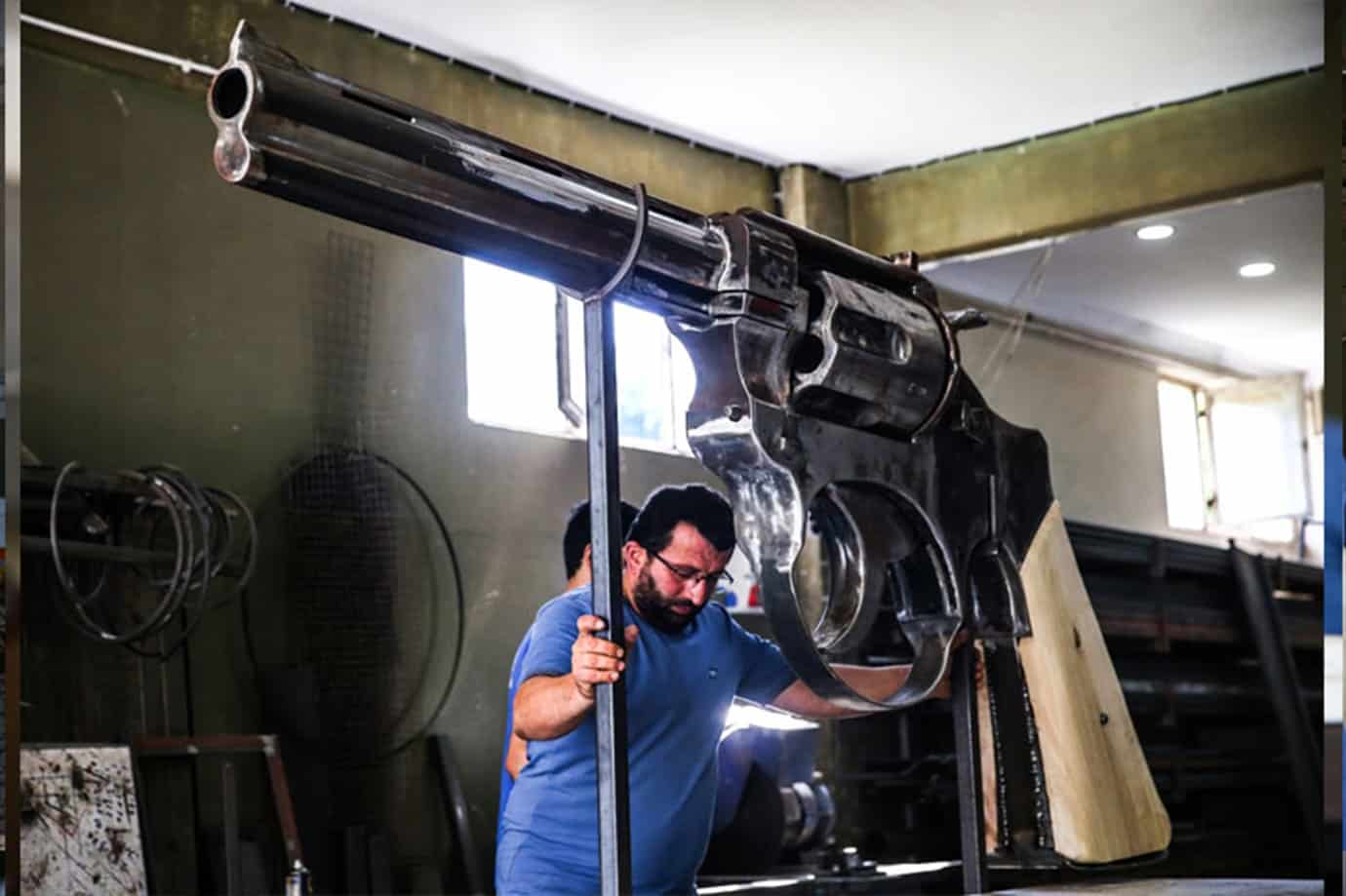 He made a giant pistol weighing 100 kg and 3 meters long