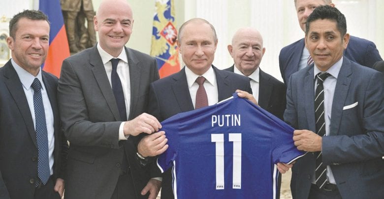 World is ‘in love’ with Russia, FIFA president tells Putin