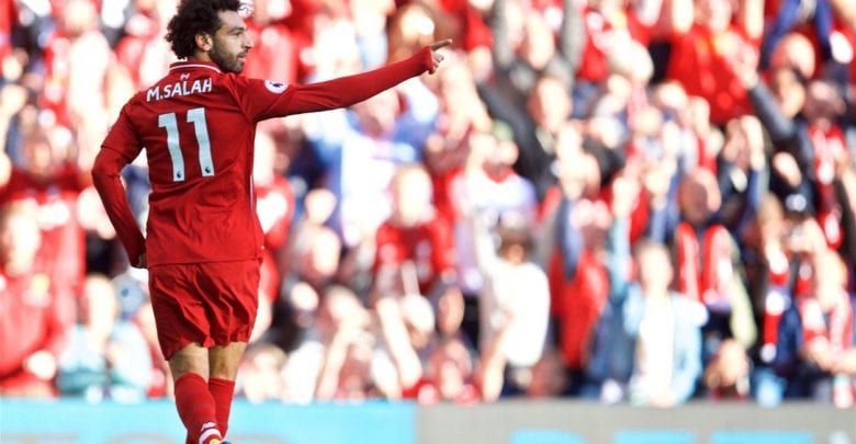 Salah strike beats Brighton to send Liverpool top