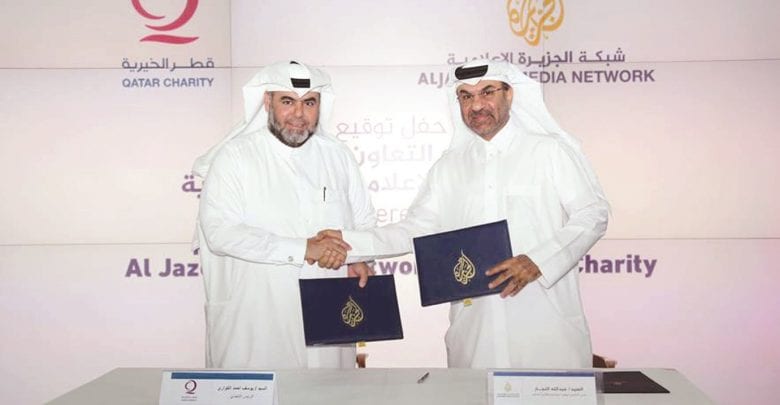 Al Jazeera, Qatar Charity sign cooperation agreement