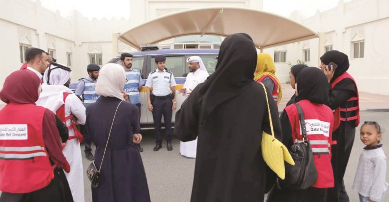 QRCS volunteers hold charity visits, distribute Iftar meals