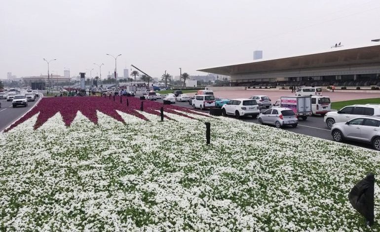 Qatar flag of flowers decorates the cornice
