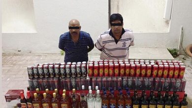 Two expats arrested for bootlegging