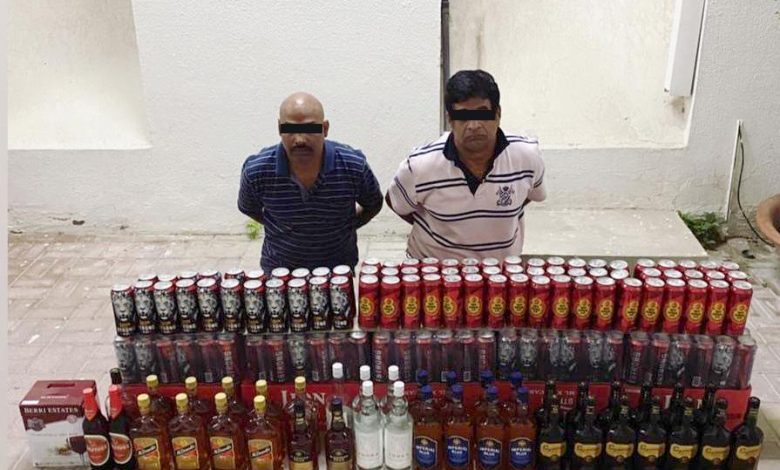 Two expats arrested for bootlegging