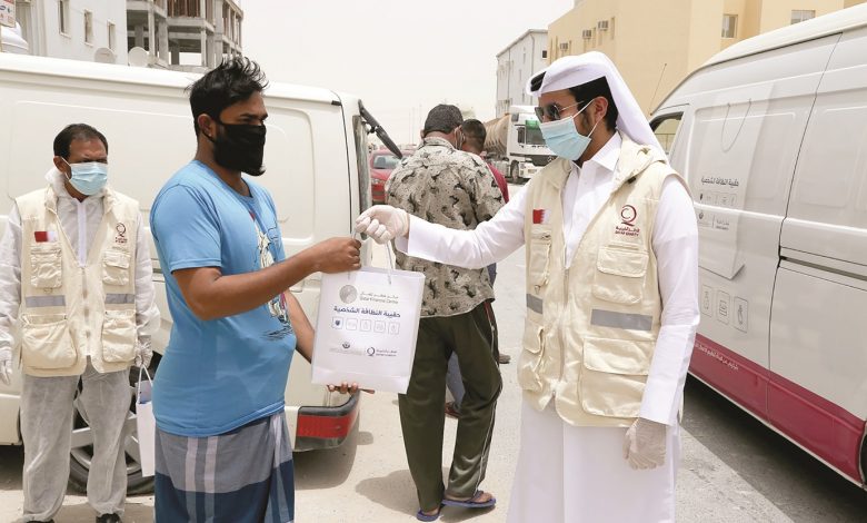 QFC, Qatar Charity donate protective kits to Industrial Area workers