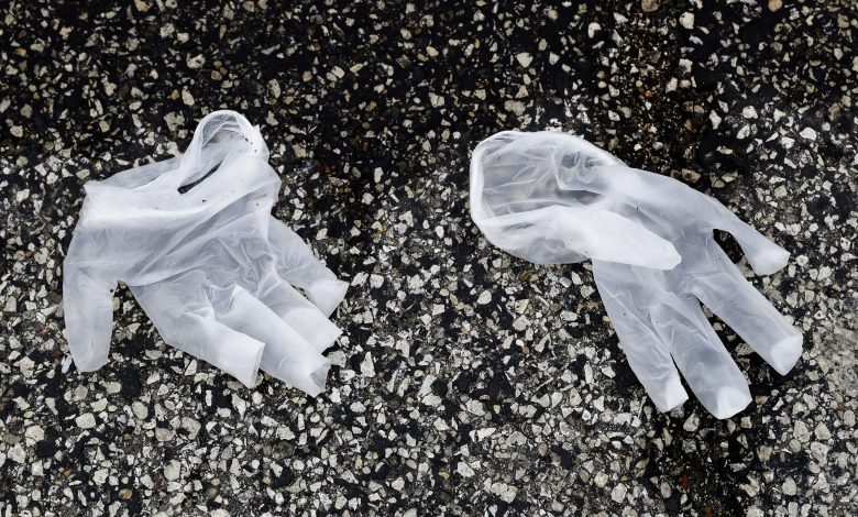 Person caught throwing used gloves on ground in Al Shahaniya