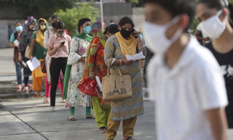India virus deaths pass 100,000