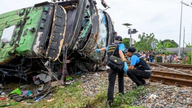 18 dead in Thailand bus-train collision