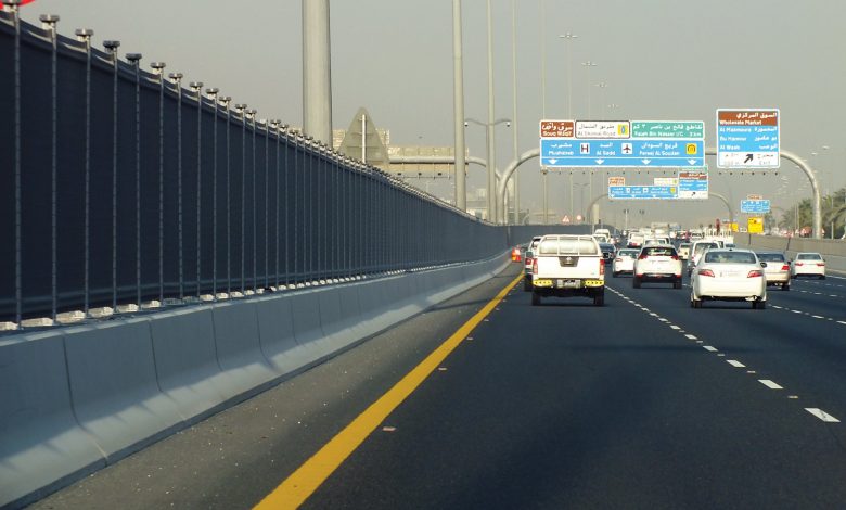 Iron barriers to prevent pedestrians from crossing Salwa Road
