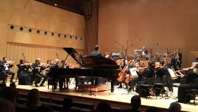 Qatar Philharmonic Orchestra performs football anthems