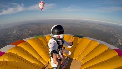 Frenchman breaks world record for standing on hot-air balloon