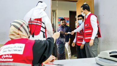 QRCS distributes food coupons to workers