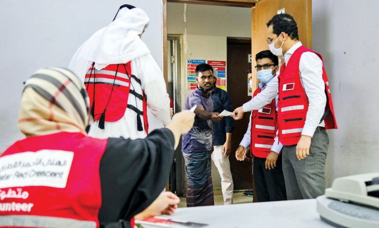 QRCS distributes food coupons to workers